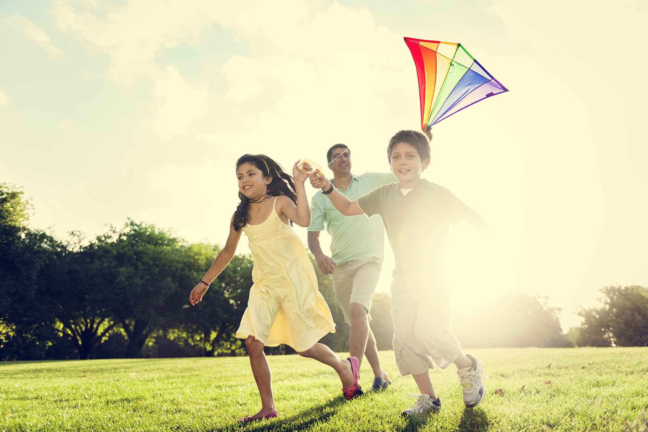 a family flying a kite